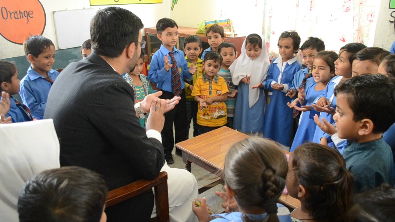 Teacher engaging with students in classroom